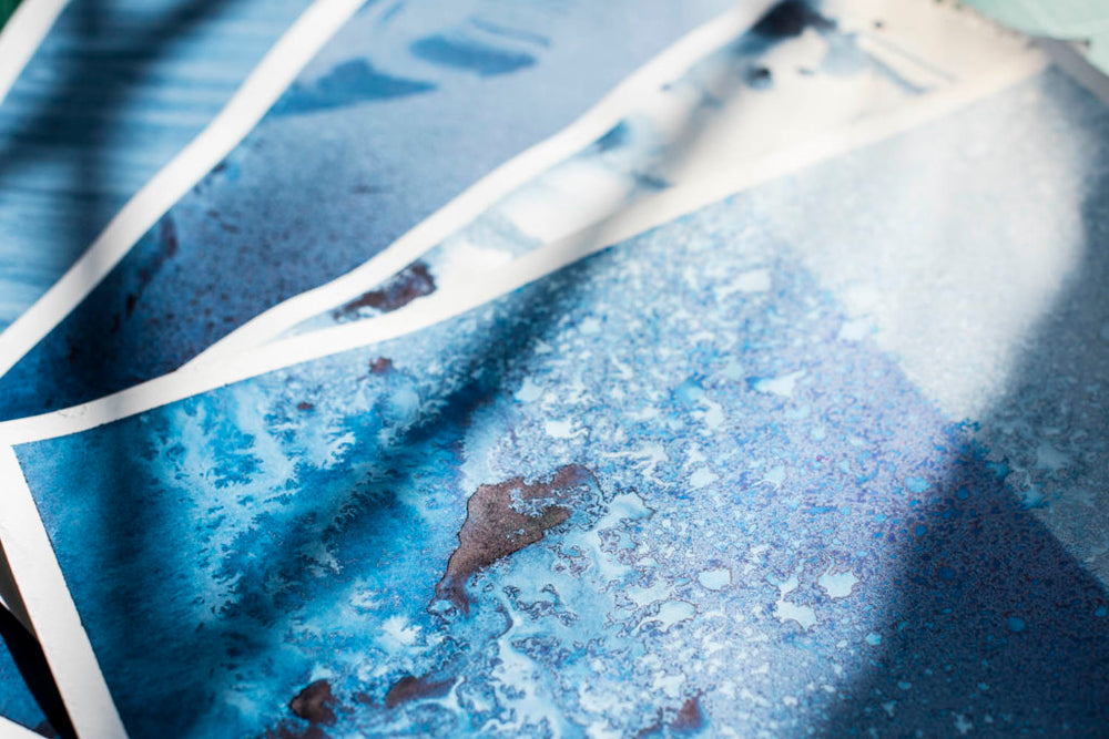 Close-up of drawing pictures with blue paint
