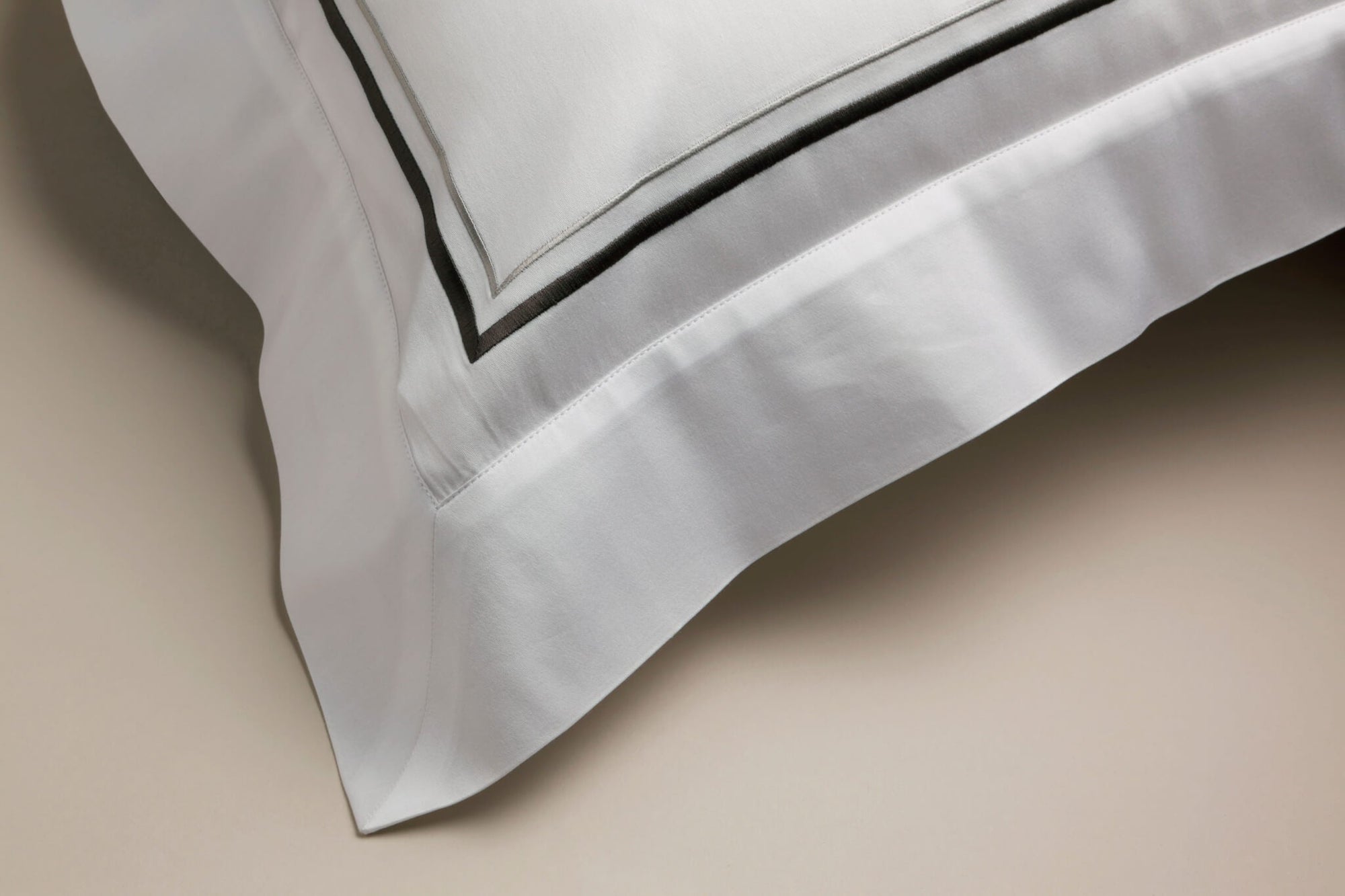 Grey corded details on an Oxford pillowcase