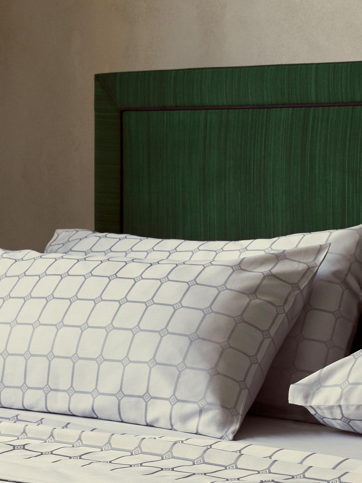 Savoir Trellis bed linen in a new silver colourway photographed against the Virginia bed.