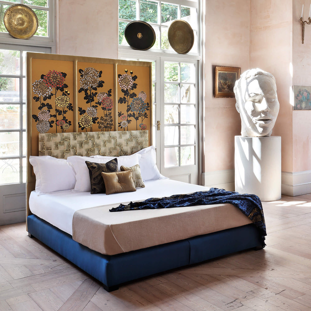 Side view of Savoir Kiku bed completely dressed in a room