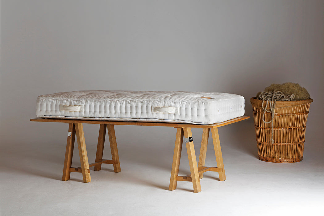 Side view of a No1 mattress with a handle on a trestle