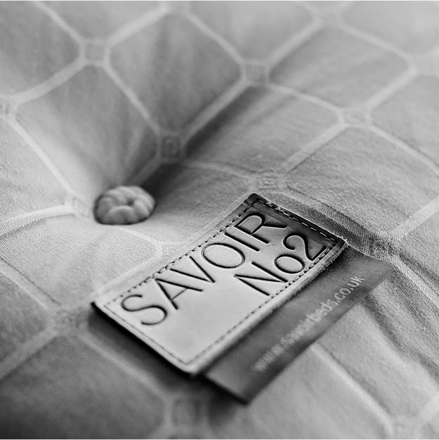 Black and white close-up picture of a Savoir No2 label