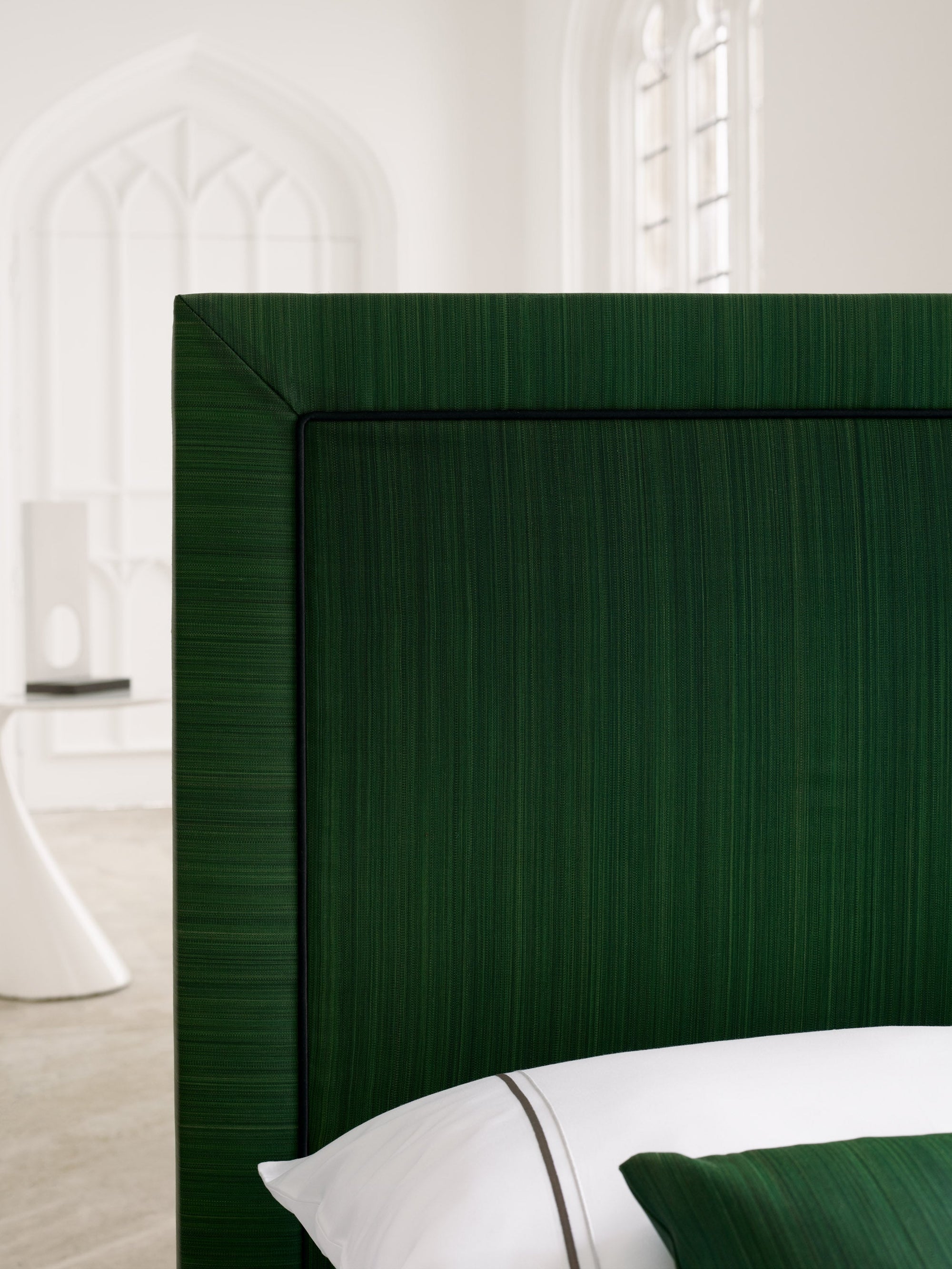 Close-up of the Savoir Virginia headboard set in a room with natural daylight