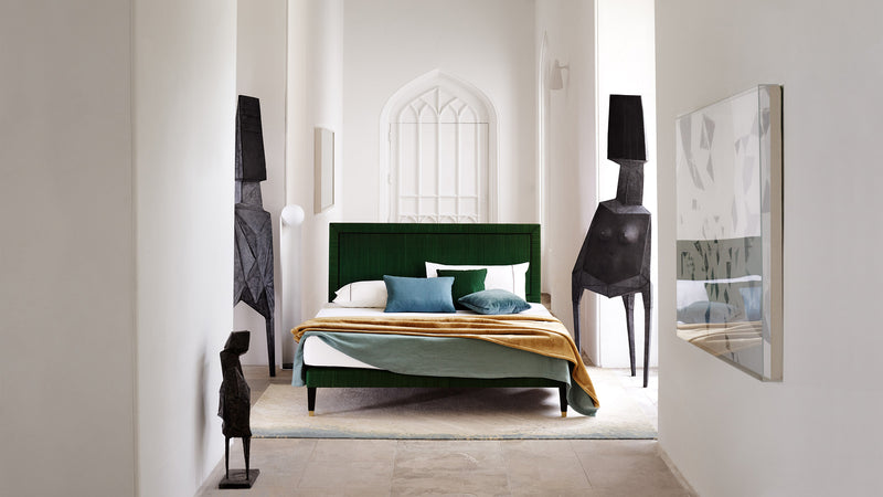 Savoir green Virginia bed amongst sculptures