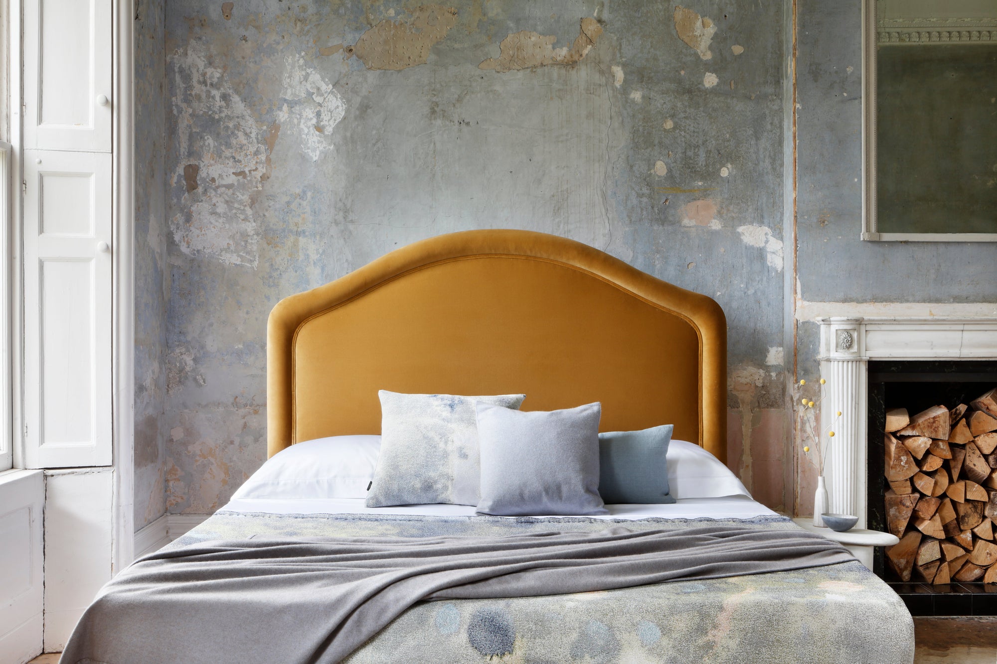 Cassie bed with a double piping headboard