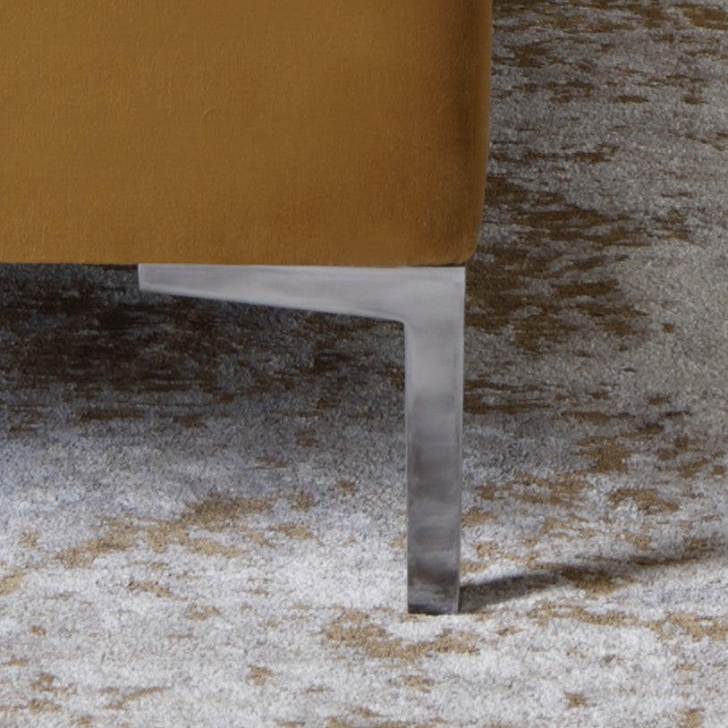 A close-up of a metal angled leg in silver finish on the Cassie bed