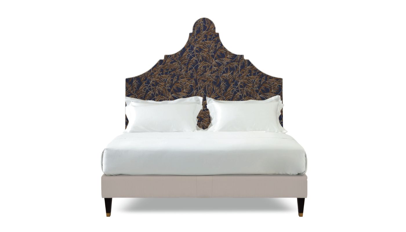 Undressed Claudia bed with a navy blue fabric on headboard and light pink on base, featuring cushions