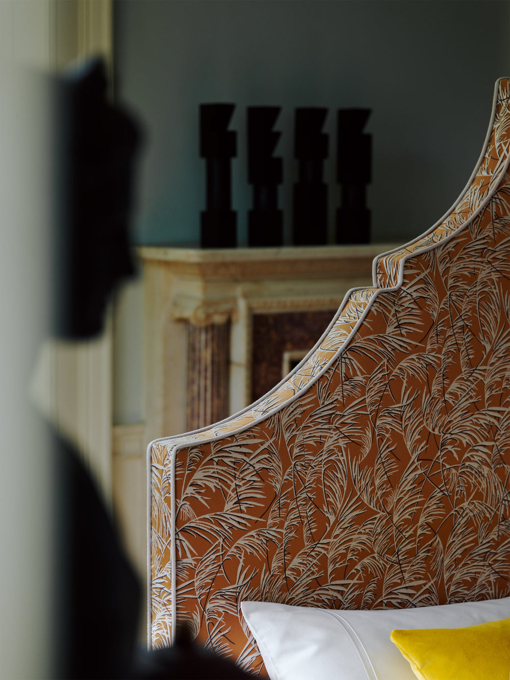 Close-up of the Claudia headboard featuring cushions