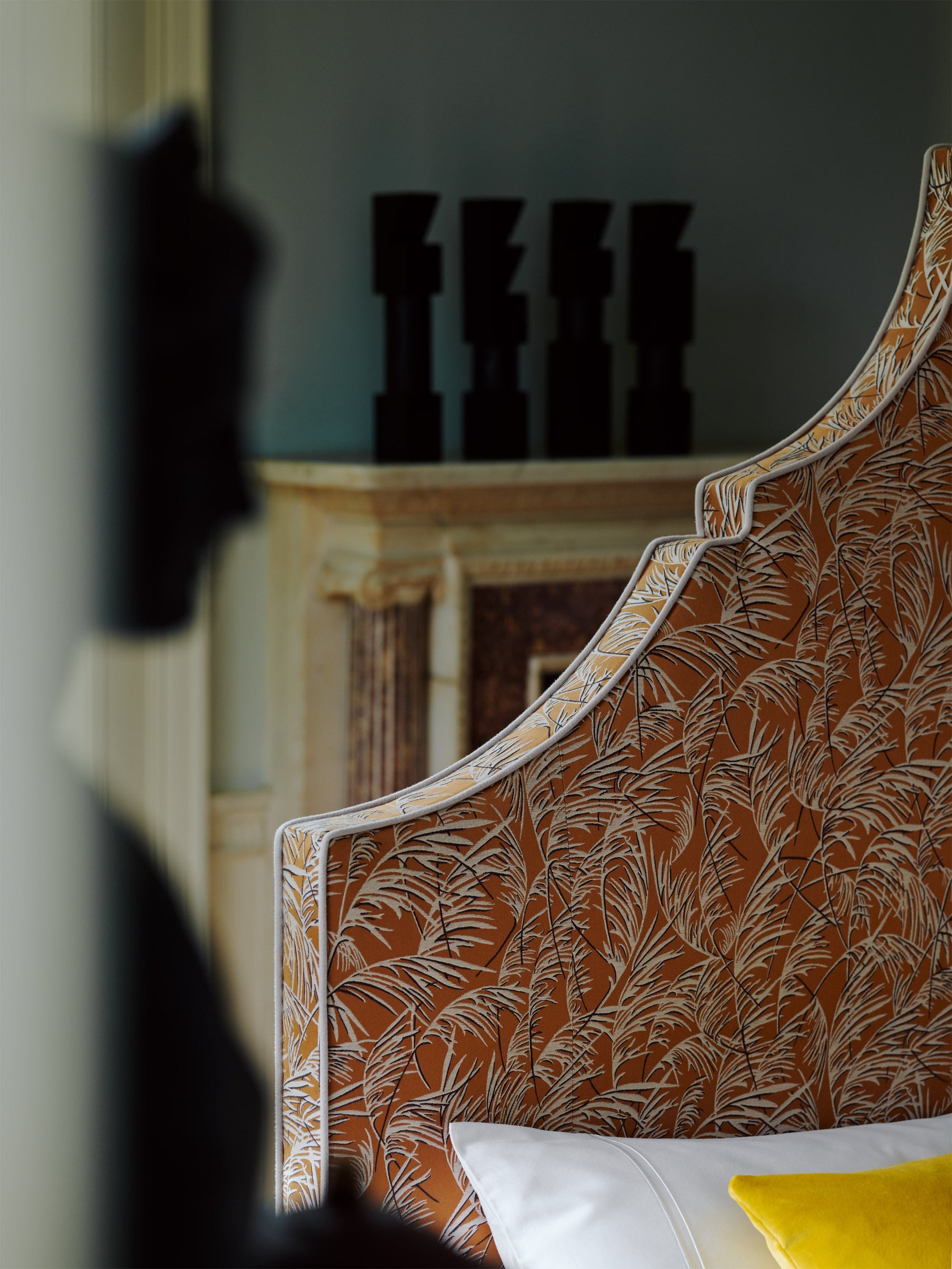 Close-up of the Claudia headboard featuring cushions