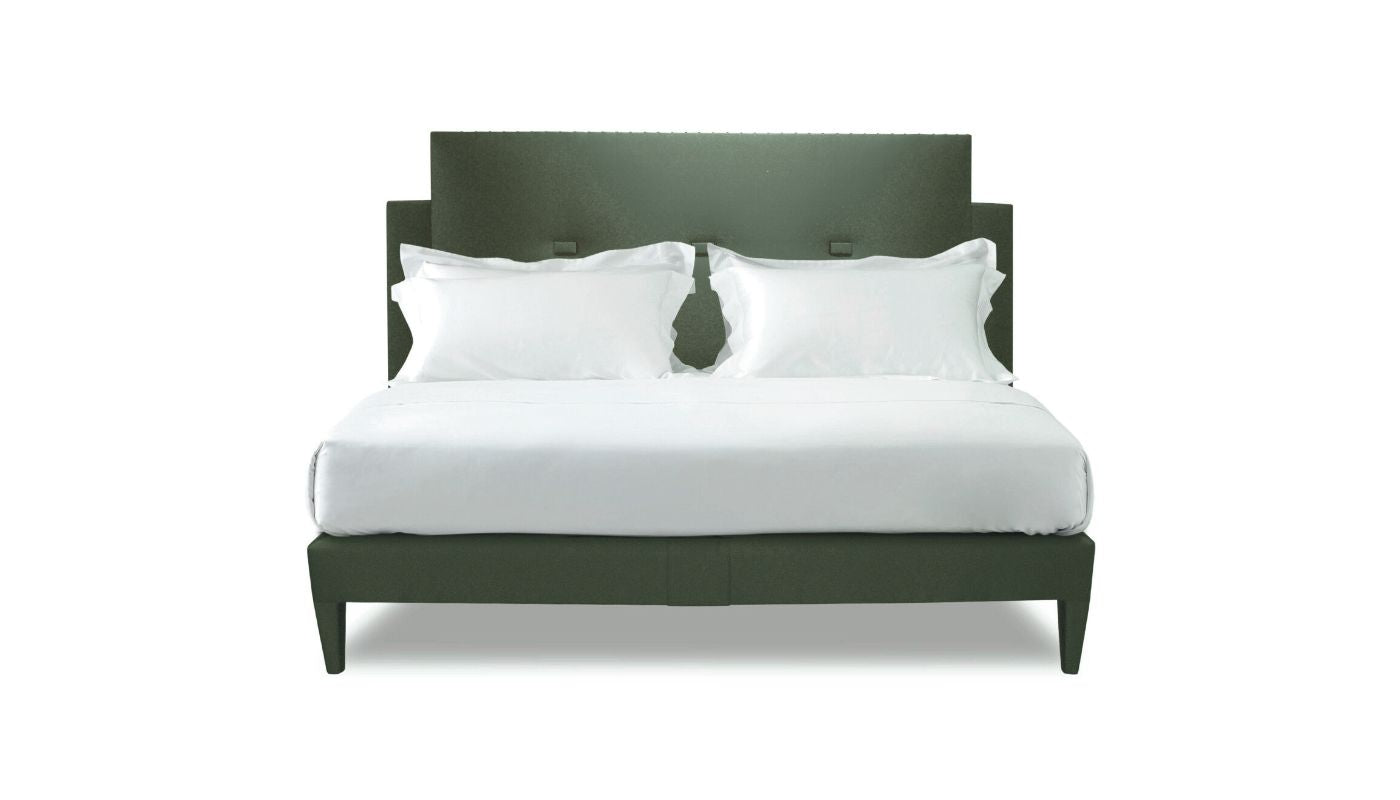 Undressed Savoy bed with a green  headboard and base featuring a mattress and cushions