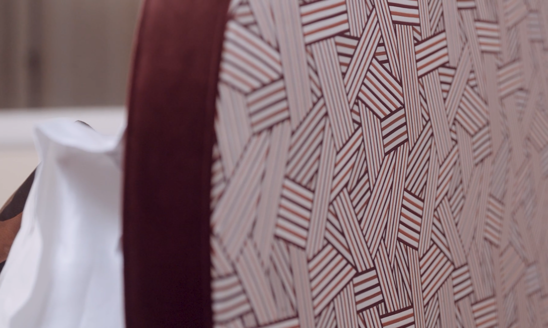 Close-up of a patterned fabric with geometric design on a blurred background