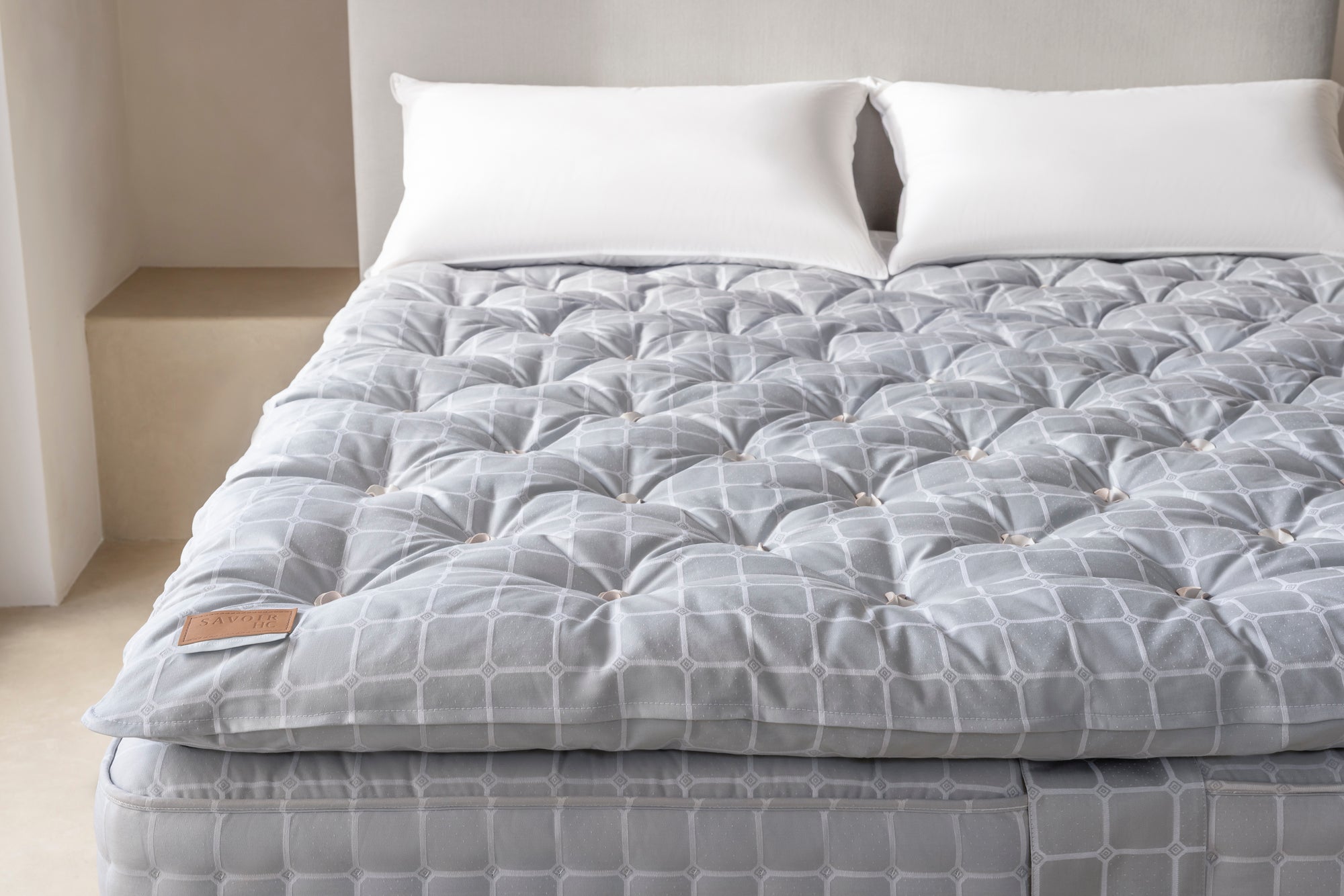 close up of a Savoir HC Topper on a mattress 