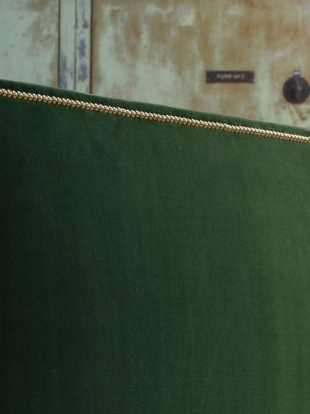 Harlech nailed green forest  headboard close-up detail