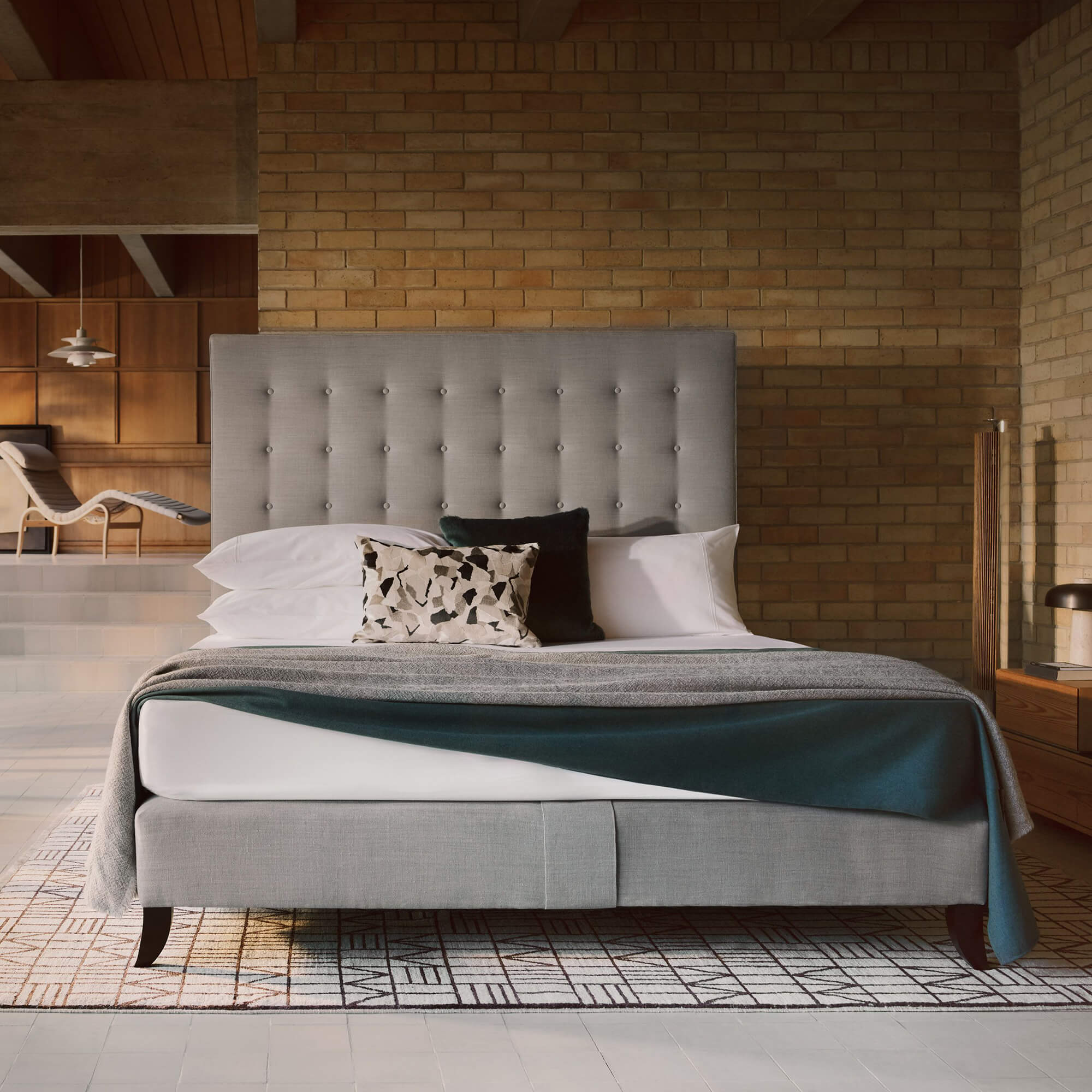 Front view of a Holly bed completely dressed in a room