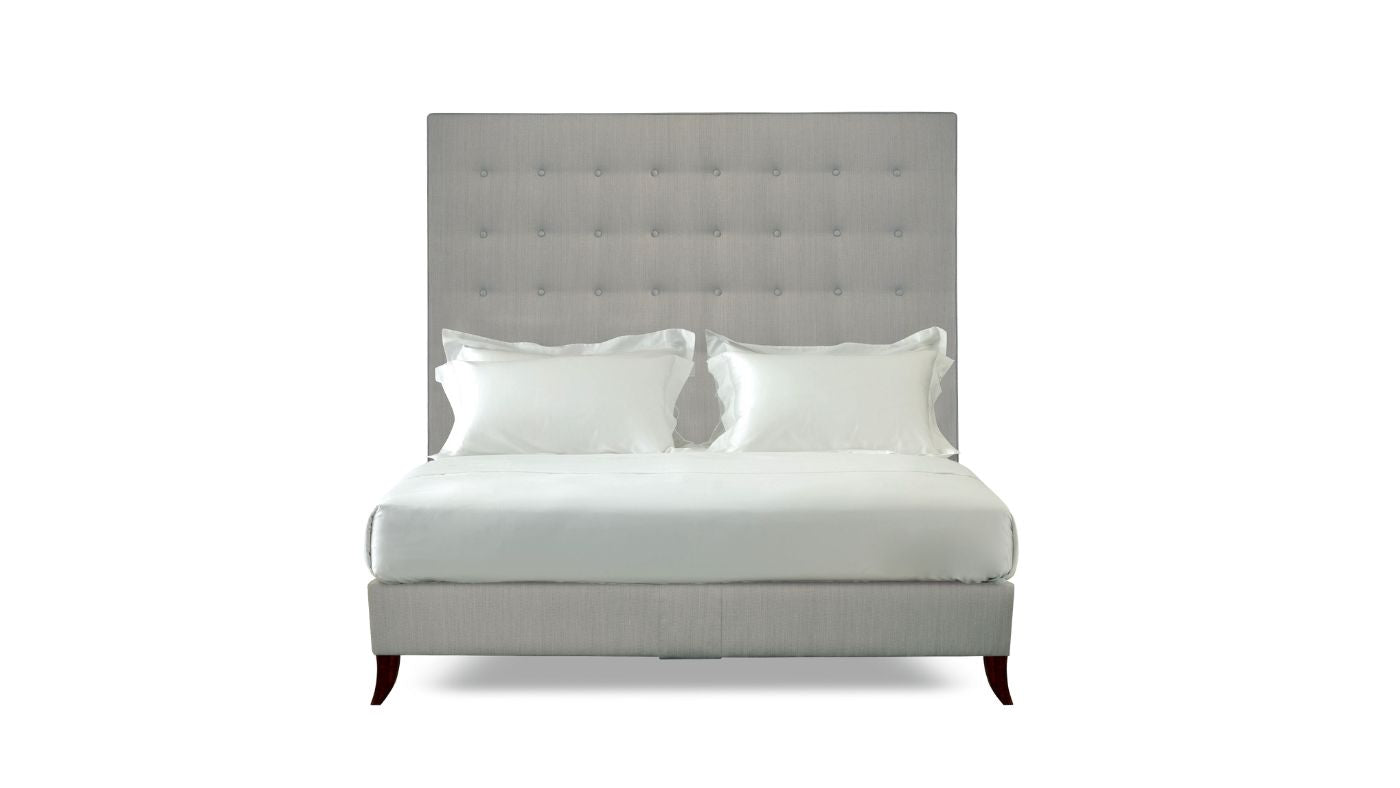 Undressed Holly bed with a light grey colour headboard and base featuring a mattress and cushions