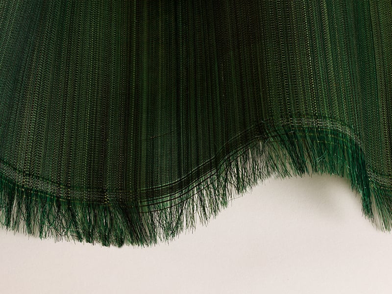 Close-up of a horsehair swatch with different shades of green