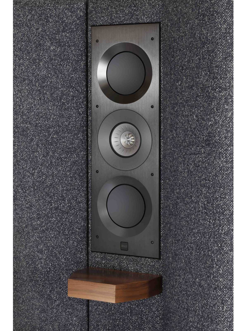 Close up image of the architectural speaker by KEF seamlessly integrated into the headboard of the Seventy Five design.