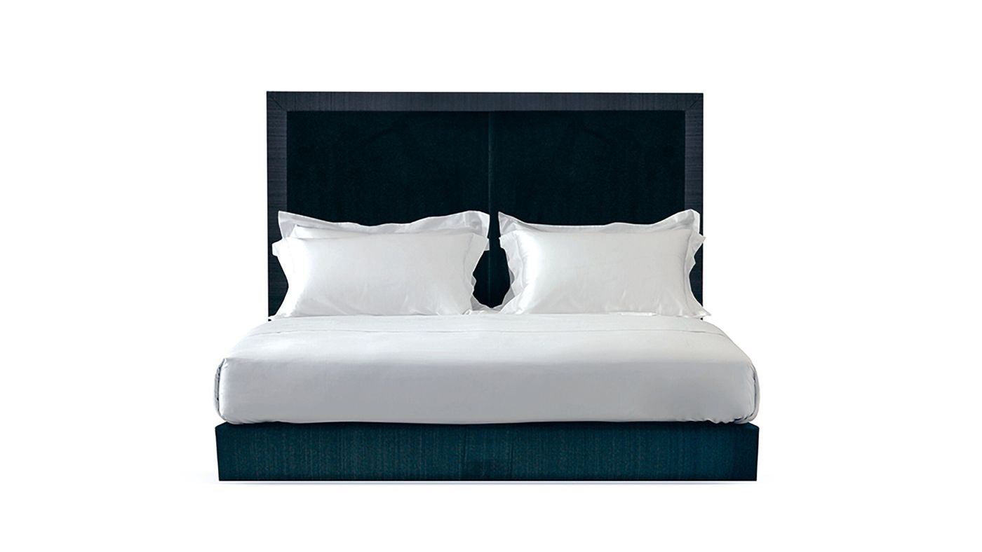 Undressed Max bed with a midnight blue headboard and base featuring a mattress and cushions