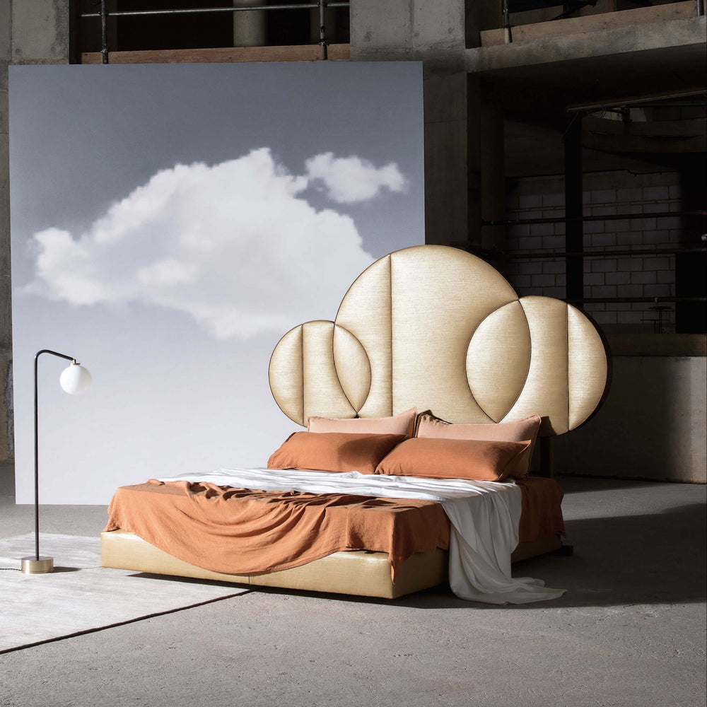 Savoir Moon bed completely dressed and set in a room