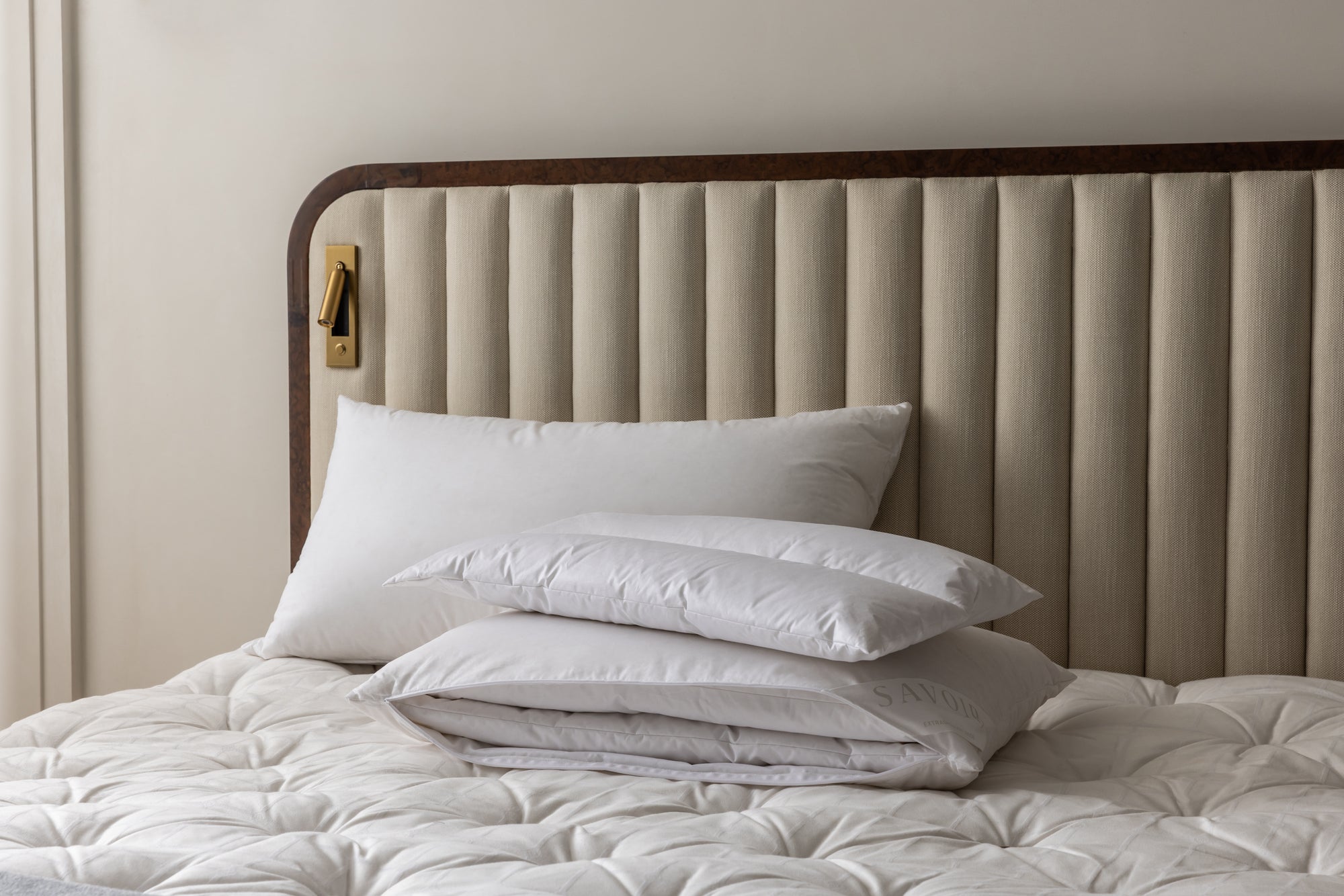 MULTI-TENSION PILLOW WITH ONE LAYER RESTING ON TOP
