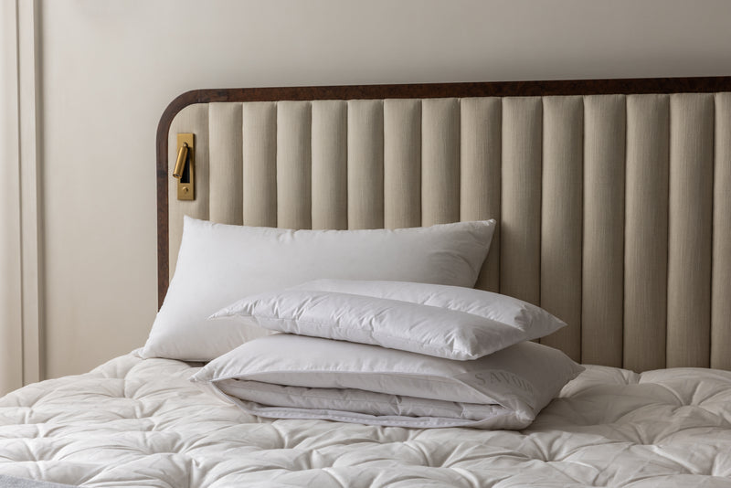 MULTI-TENSION PILLOW WITH ONE LAYER RESTING ON TOP