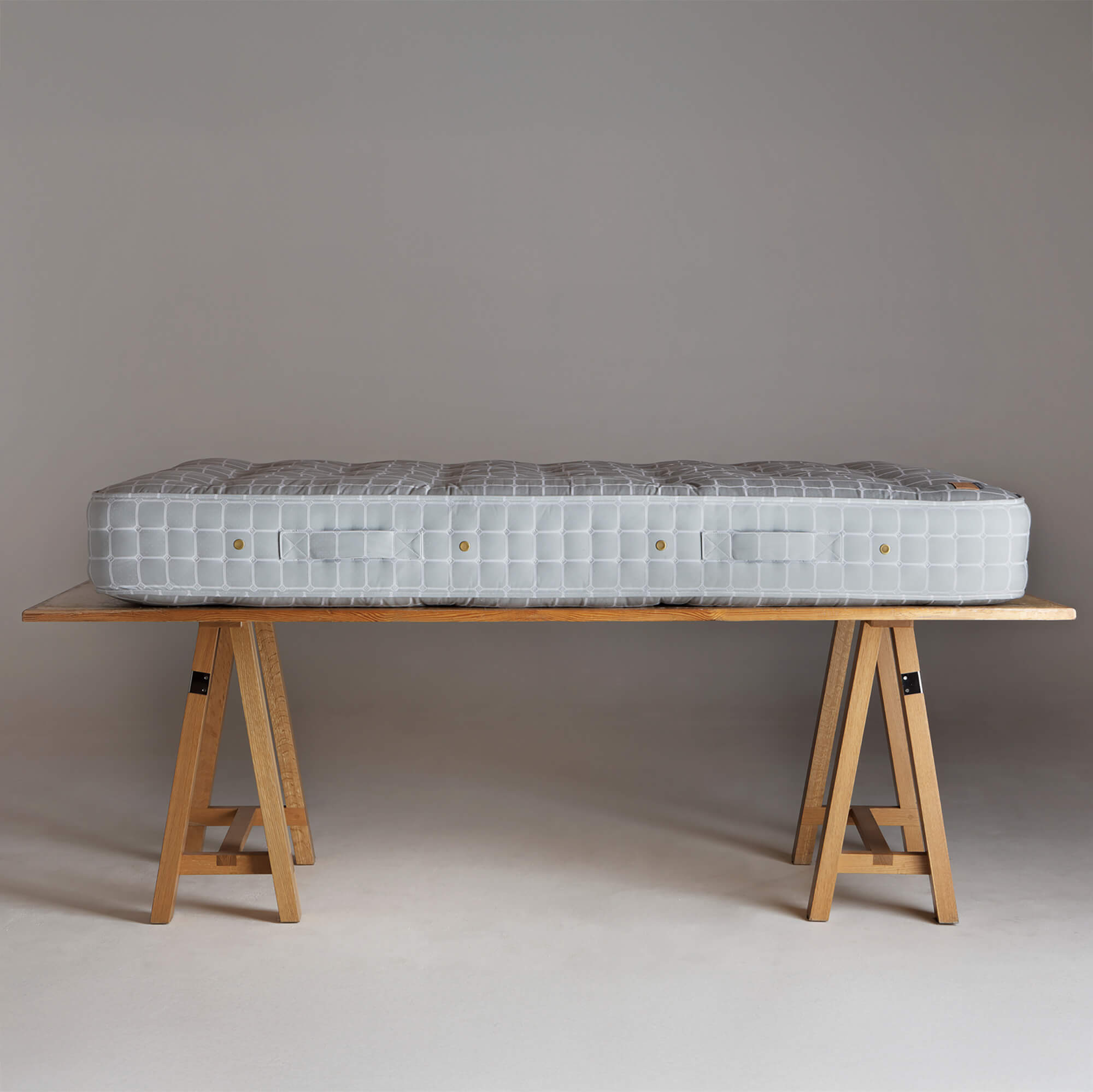 Side view of a No.4 mattress on a trestle
