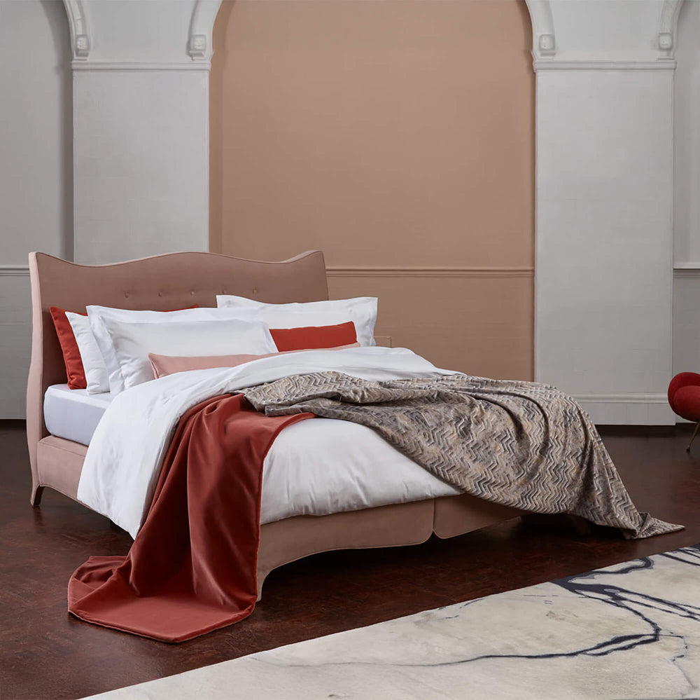 Savoir Penelope bed completely dressed with cushions