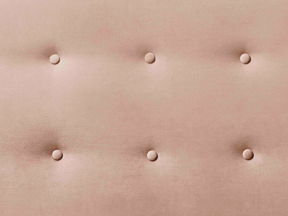 A close-up of the buttoning on the Penelope headboard