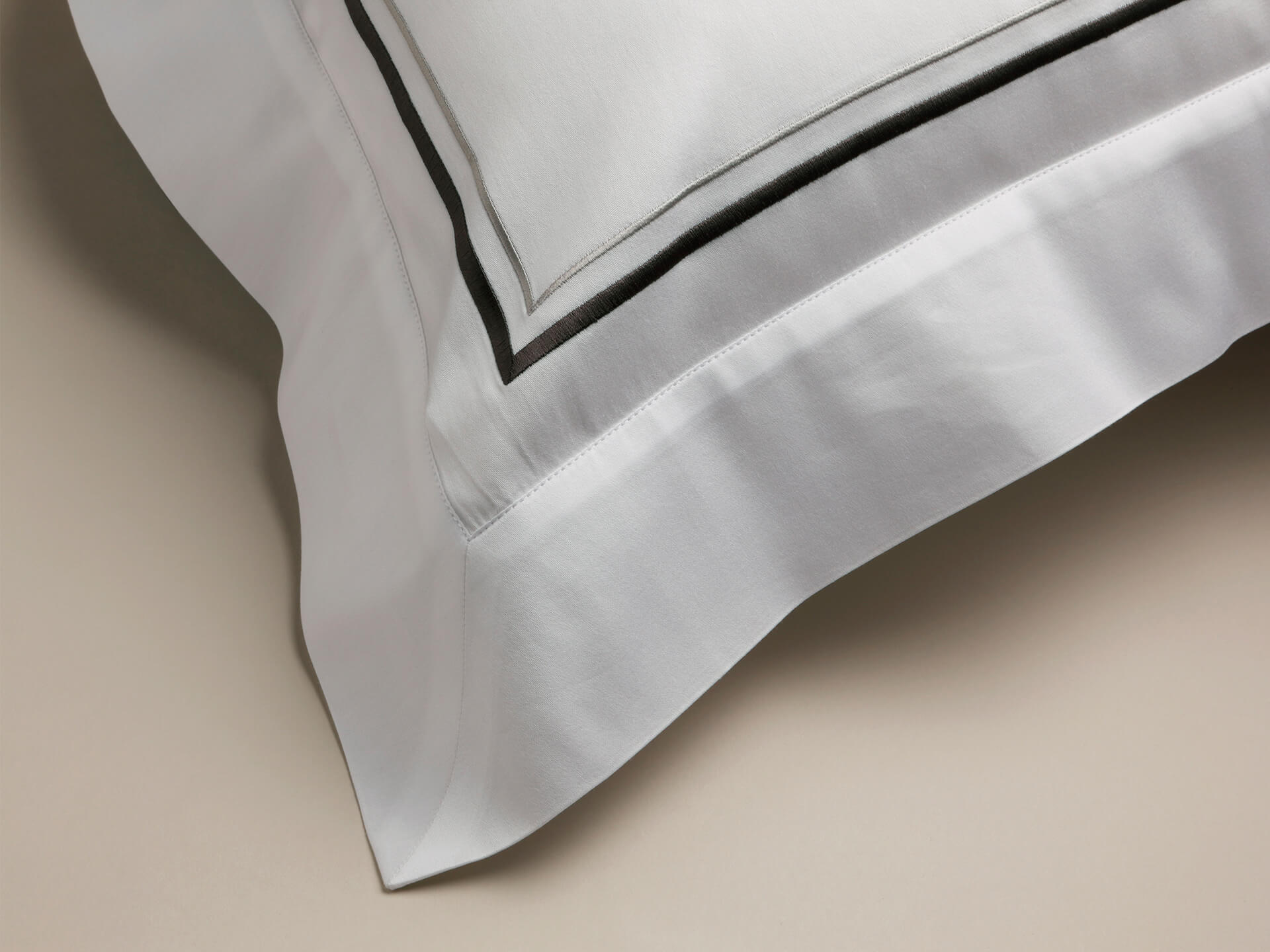 Grey corded details on a pillowcase with a sateen finish