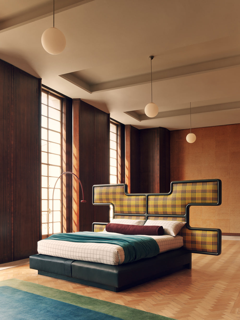 Modern bedroom with the Authenticity bed design featuring plaid patterns and wooden flooring.