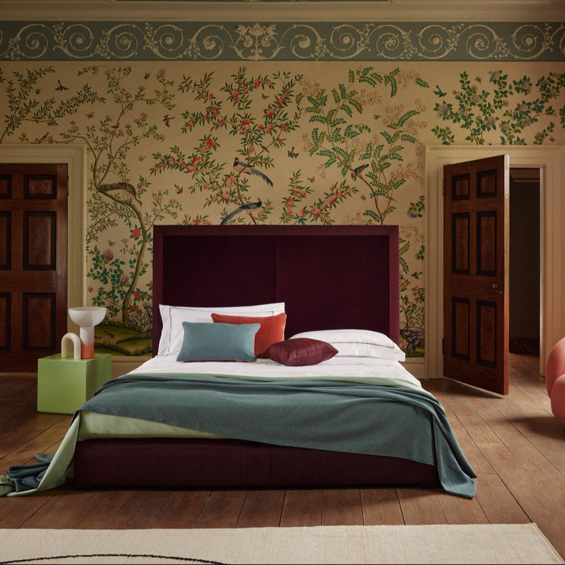 Front view of the Savoir Max bed with capacious panels and rich textures