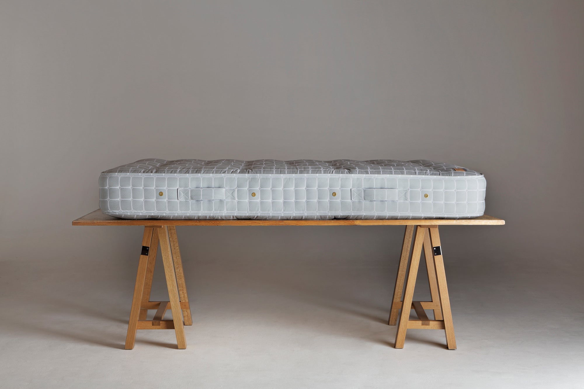 Side view of a No.4 mattress on a trestle