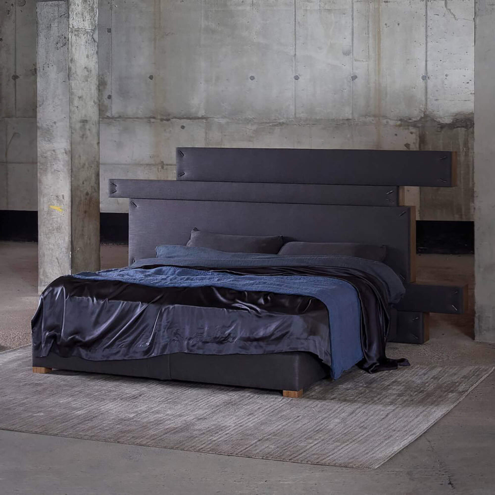 Savoir Shift bed completely dressed and set in a room