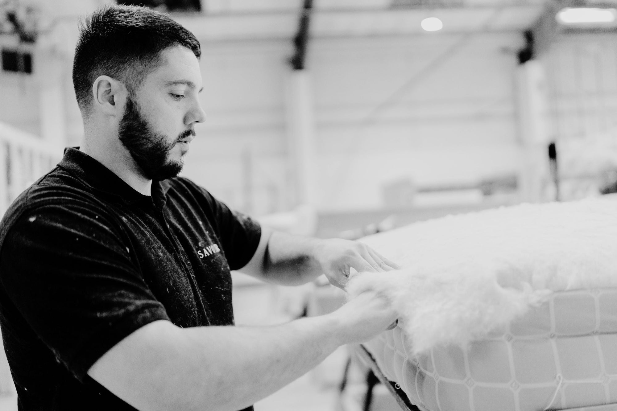 Mattress in the making by a craftsman in Savoir Beds in Wales