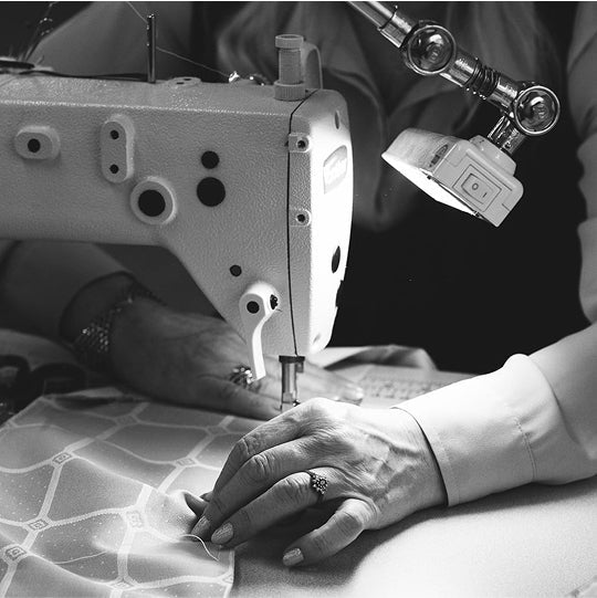 Savoir seamstress working on a Savoir fabric