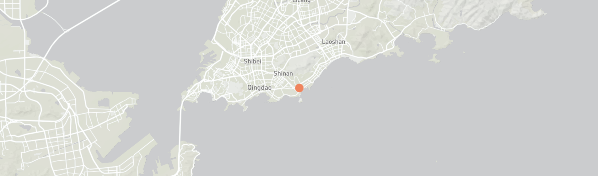 Map of a coastal area with a red dot indicating a location.